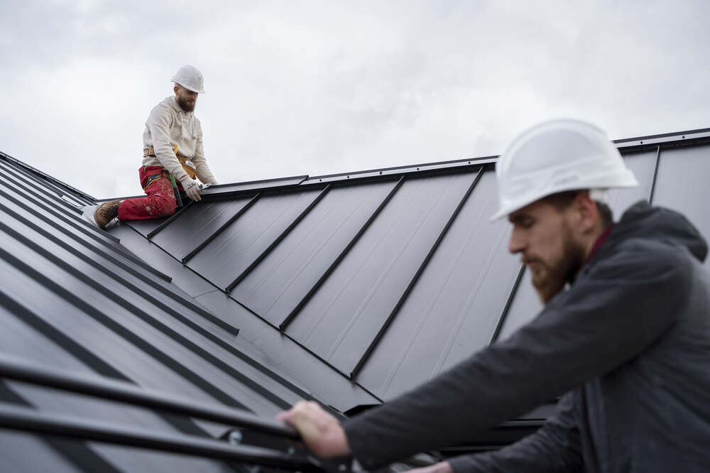 Roofers finishing the roof